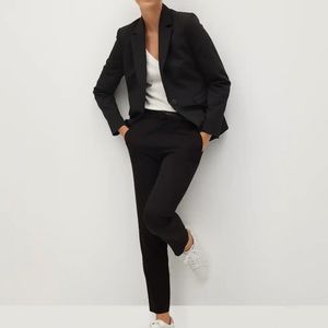 Black casual pant with belt.